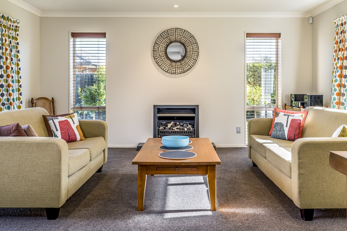 Empty but freshly cleaned room (wooden floor, white walls, sunlight coming in)